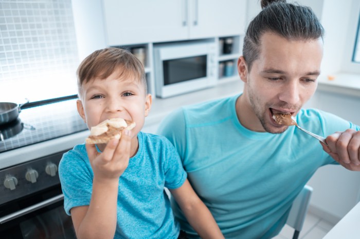 A father and son eat no-nut butter