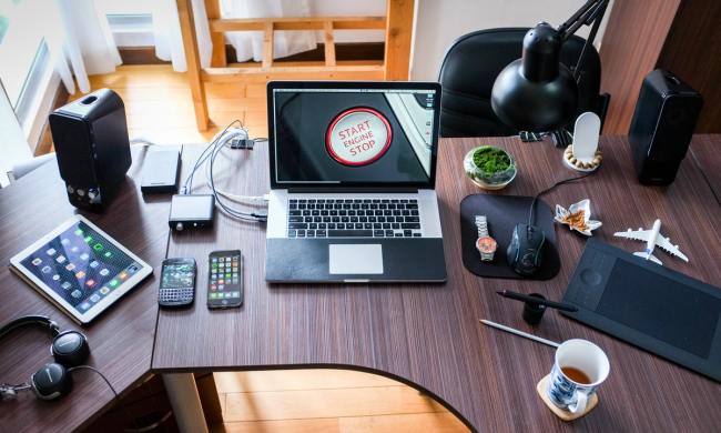 Apple products and electronics neatly all over a desk