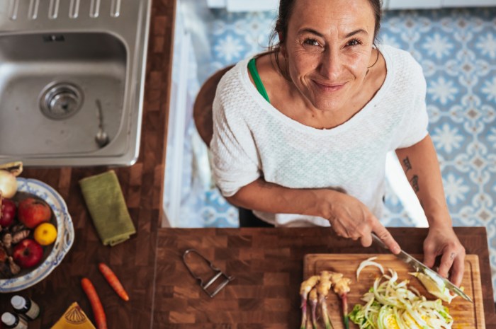 A woman cooks vegan food