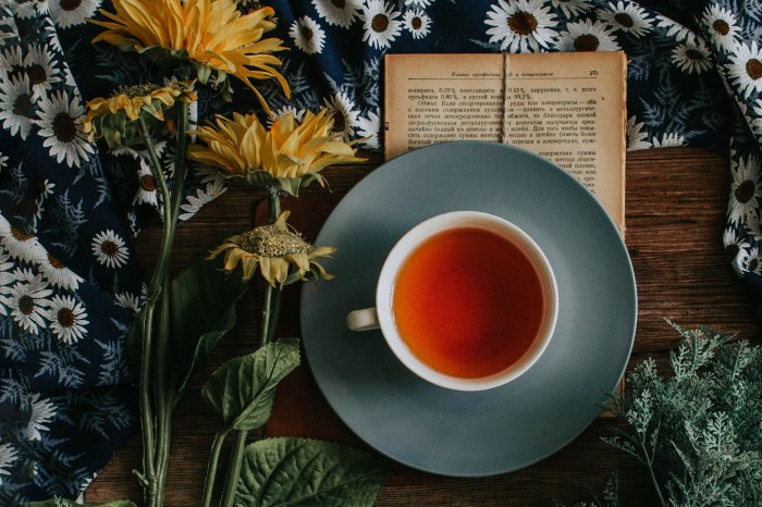 Cup of tea with flowers and a book