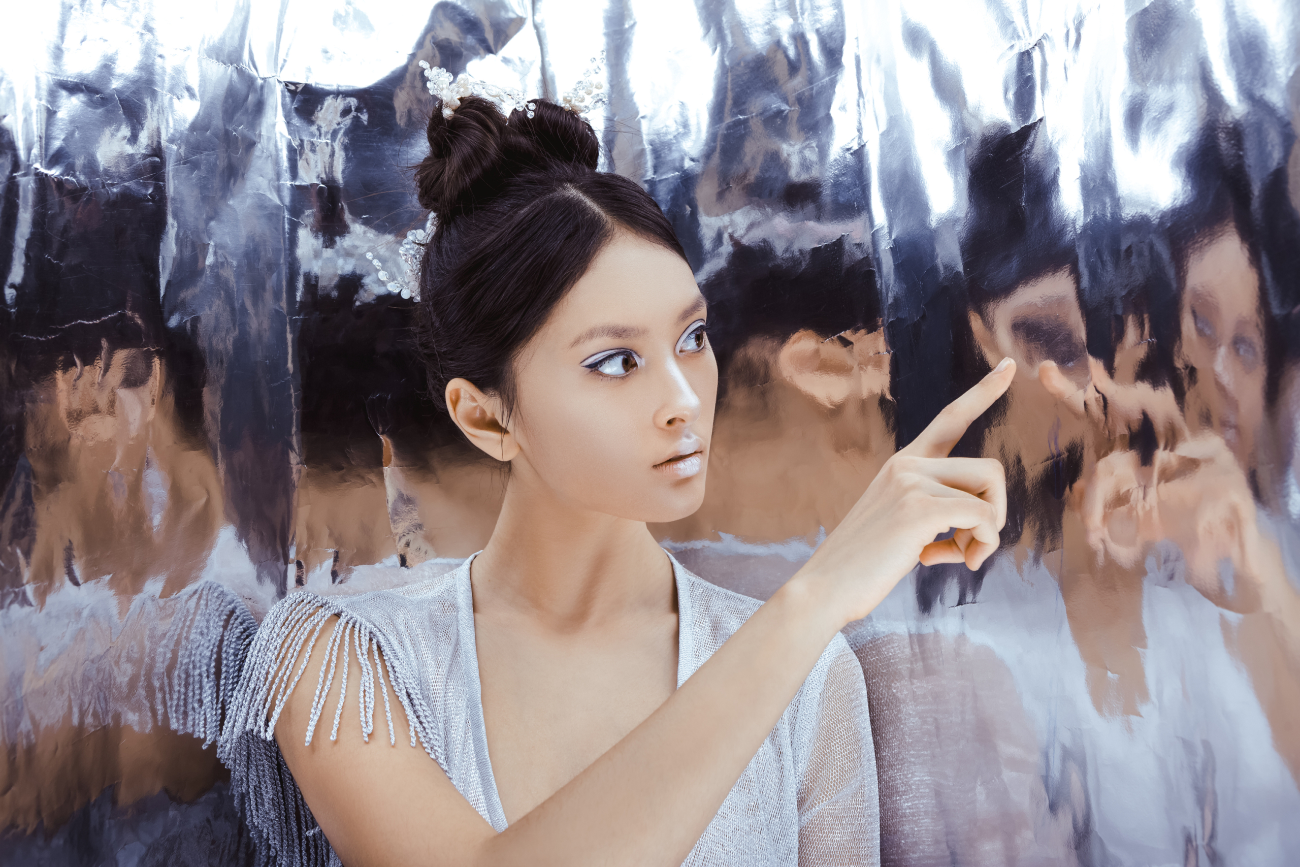 Girl looks at distorted reflections