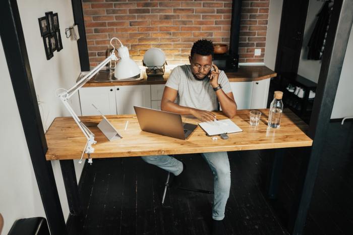 A man working in his home office space.