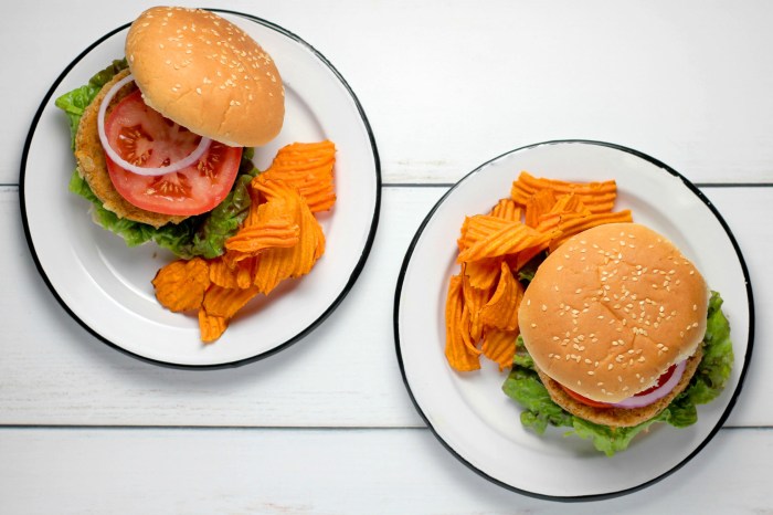 Two veggie burgers with chips