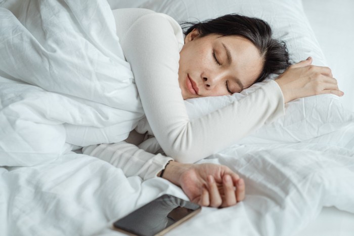 woman-sleeping-with-phone