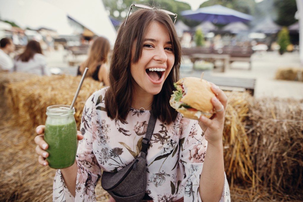 A woman eating vegan protein