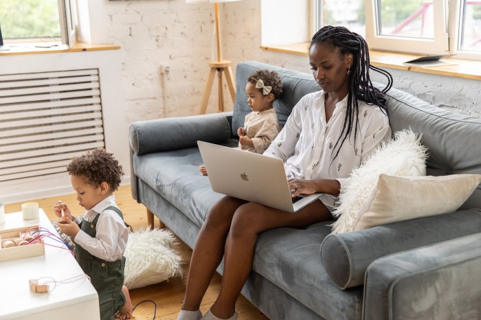 Woman working remotely with her children
