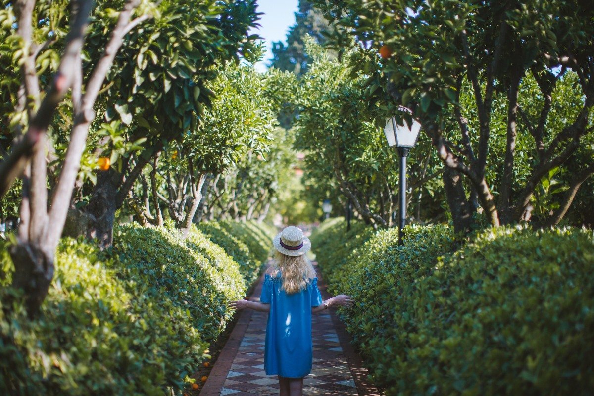 blonde-woman-walking-through-park