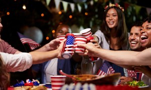 Group of friends toasting at a Fourth of July party
