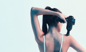 percussion massage gun benefits massager woman