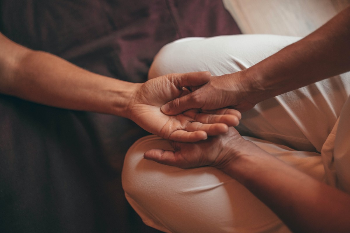 person-receiving-hand-massage