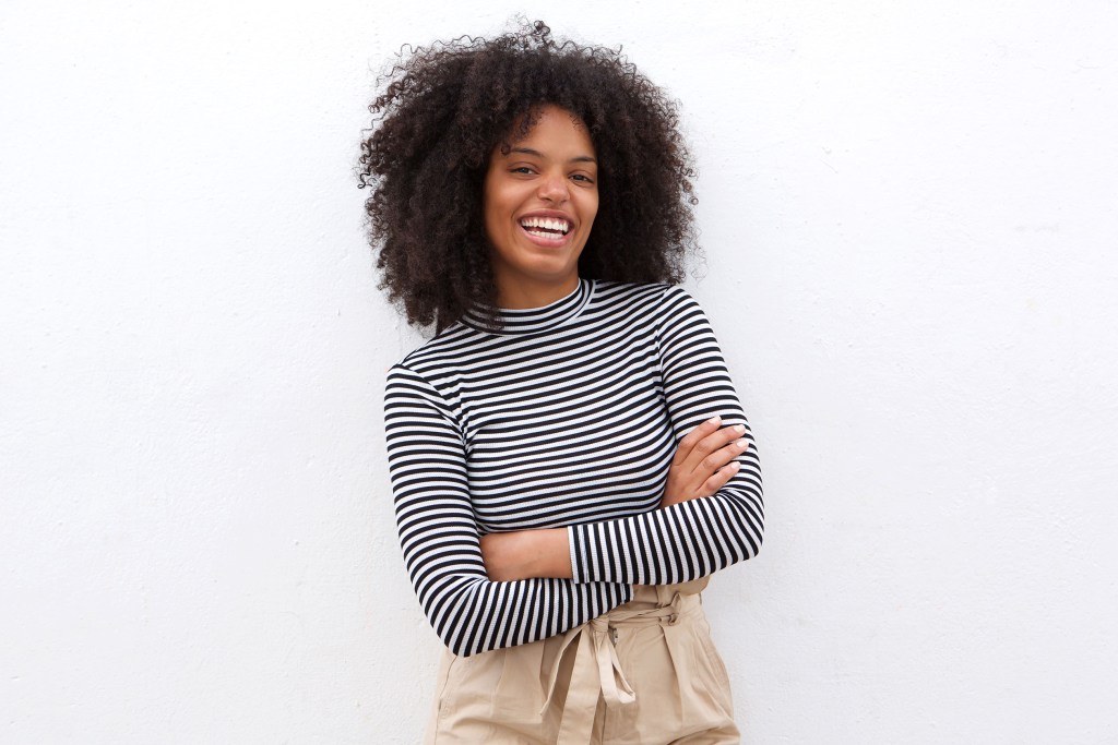 Smiling woman wearing black and white stripes