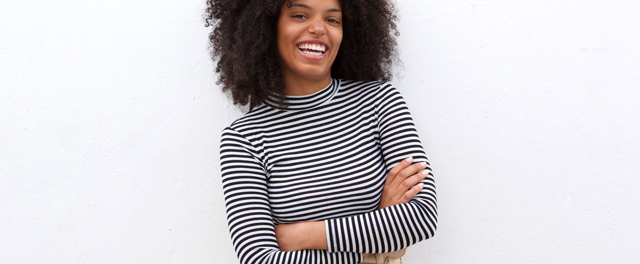Smiling woman wearing black and white stripes