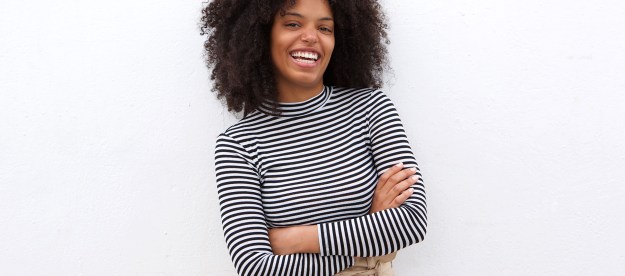 Smiling woman wearing black and white stripes