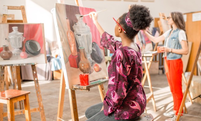 Women taking a painting class