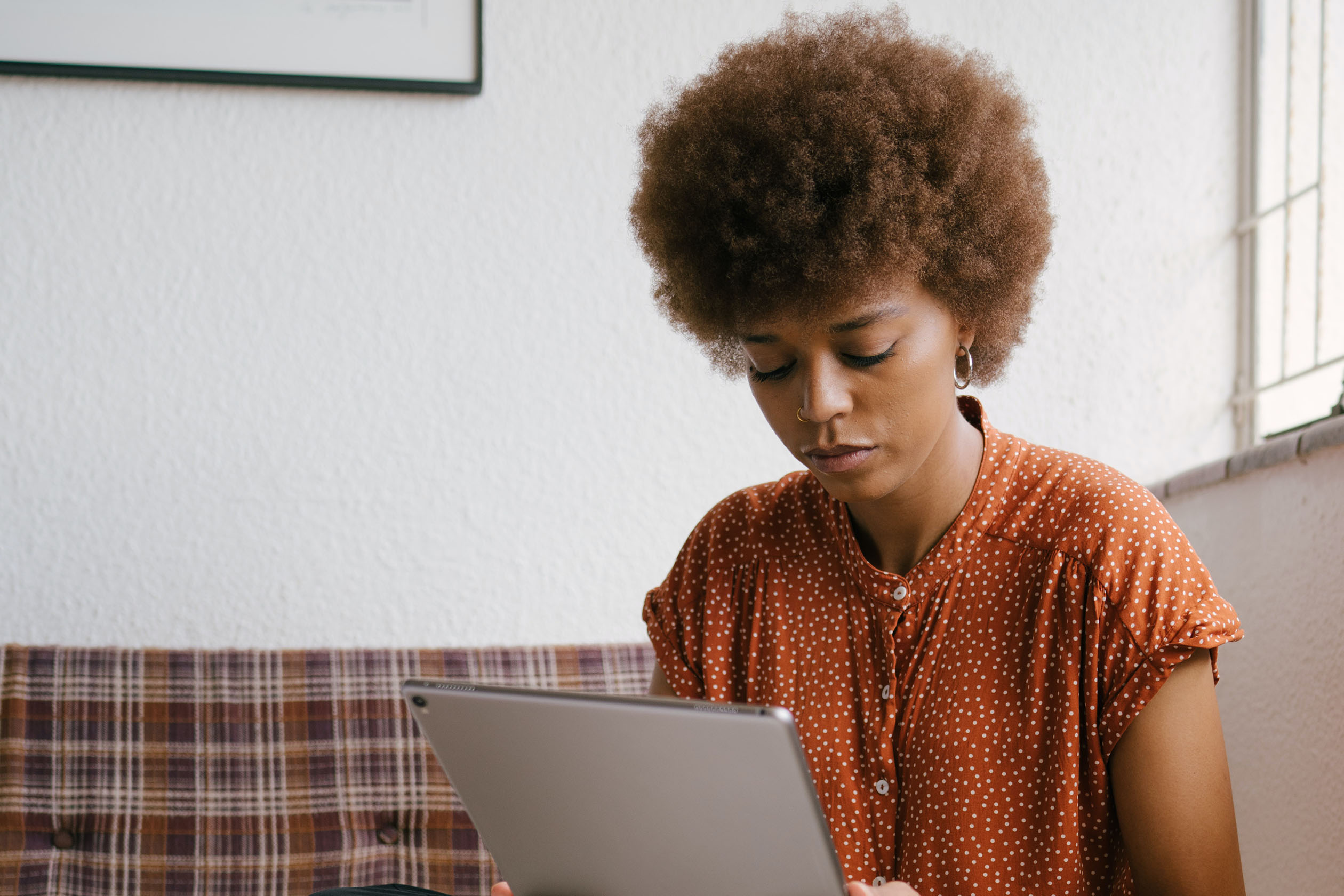 Woman working from home in a polished blouse