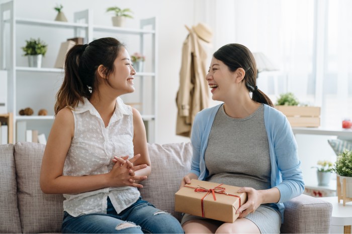 Woman giving a gift to another woman