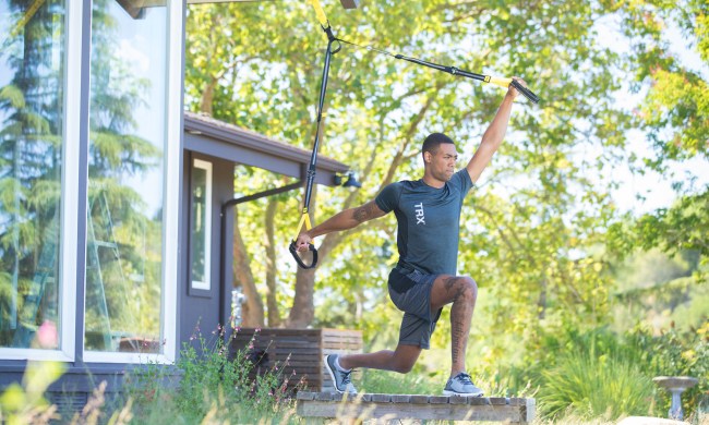Man working out on porch with TRX