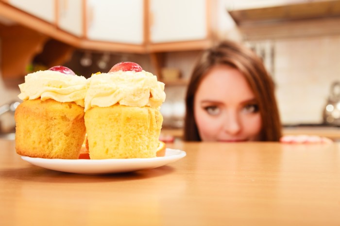 stop sugar cravings woman cupcake