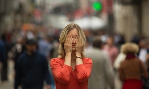 woman having anxiety attack in public place