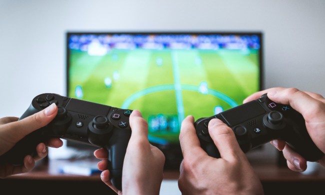 two people playing video game on flatscreen