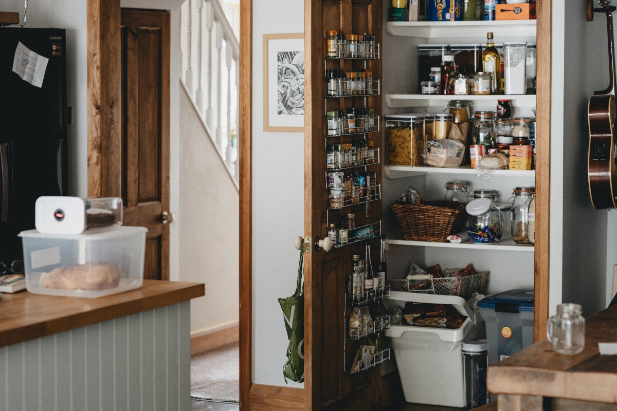 a wide shot of a large, full pantry