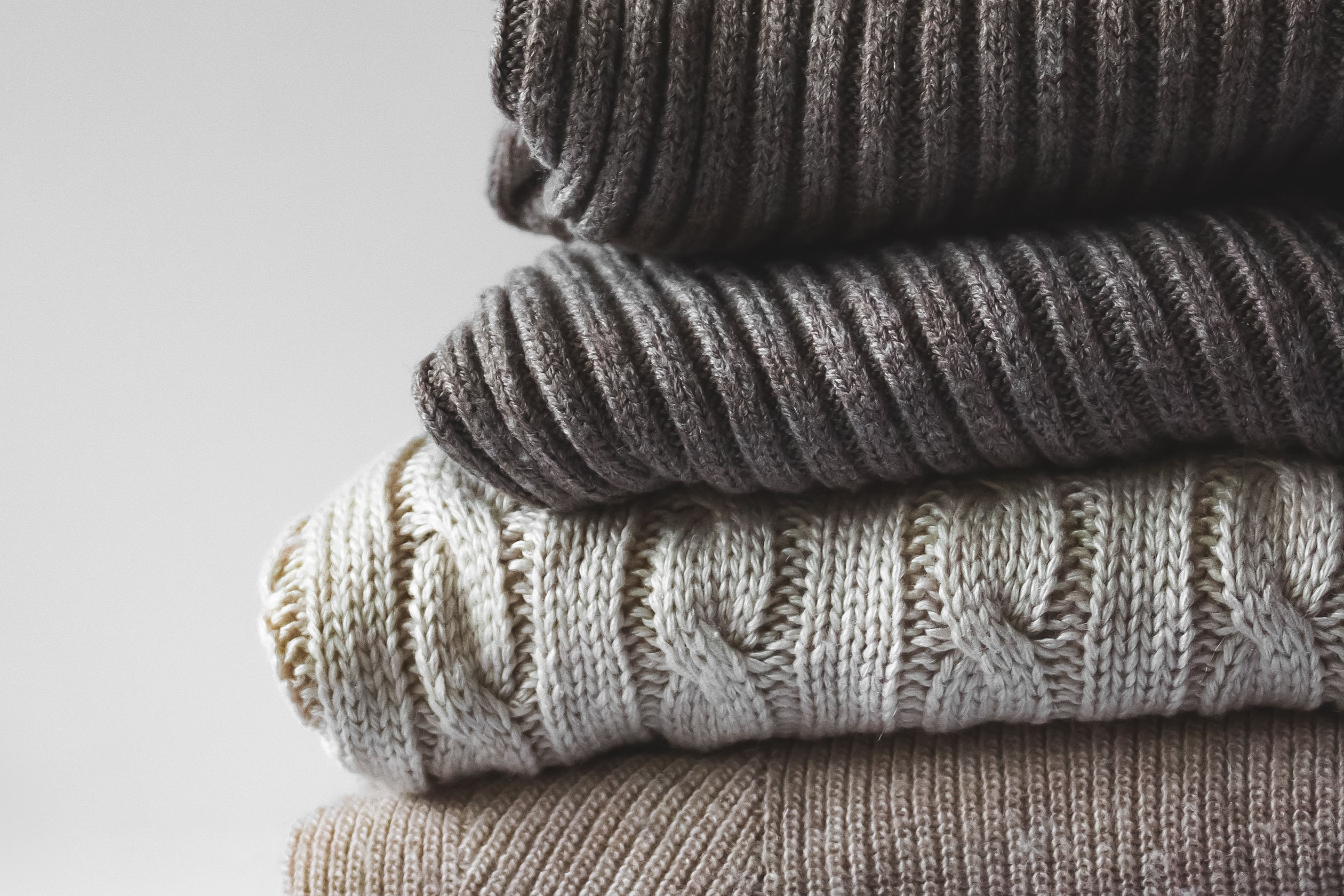 Pile of folded sweaters