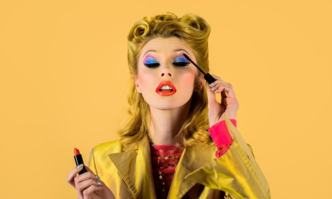 A woman putting on trendy eye makeup.