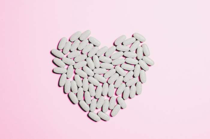 taking vitamins to look younger white in the shape of a heart