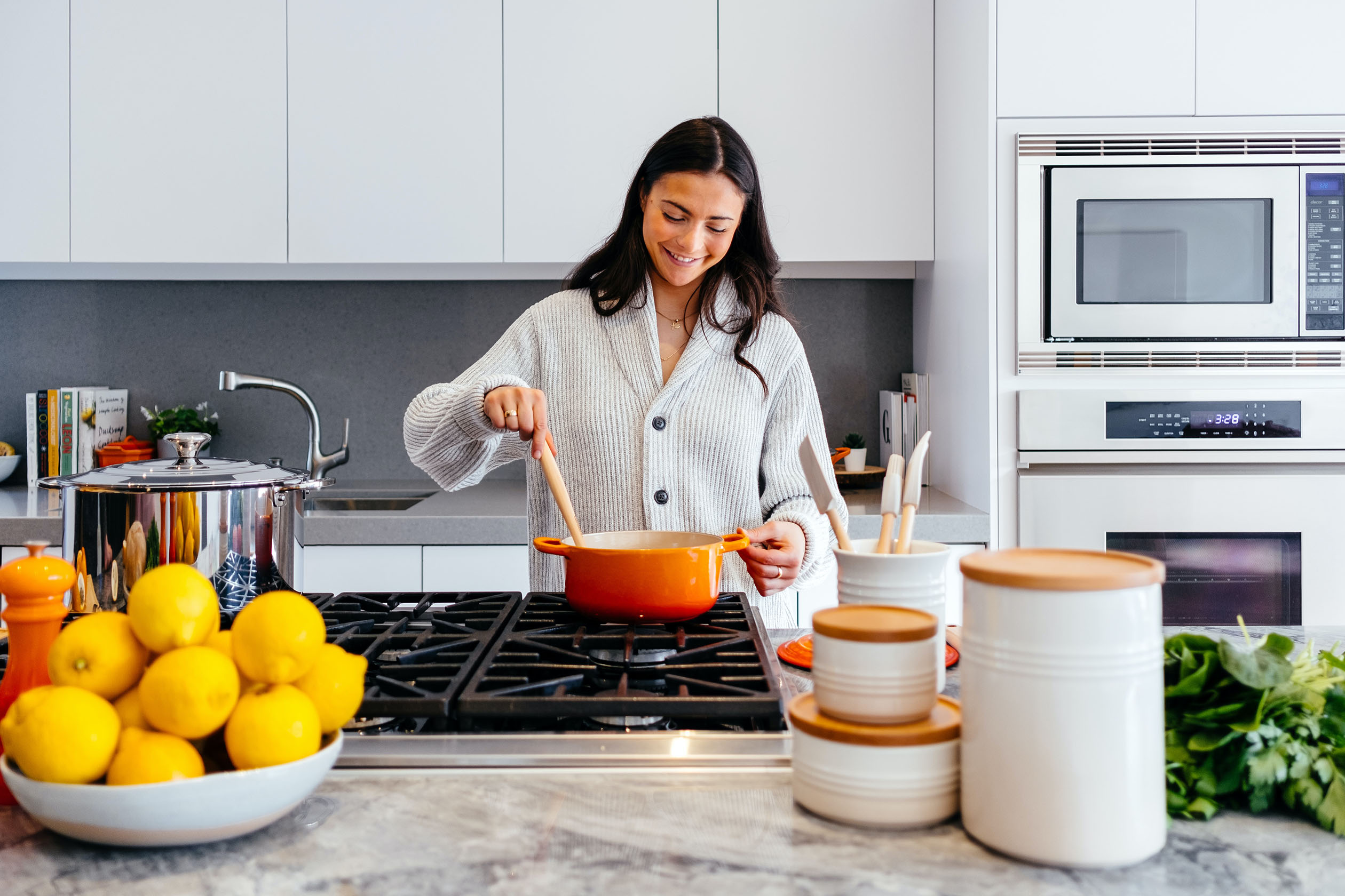 Woman cooking with a saucepan