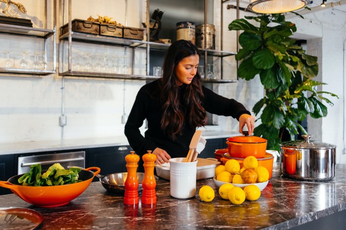 Woman cooking with orange cookware