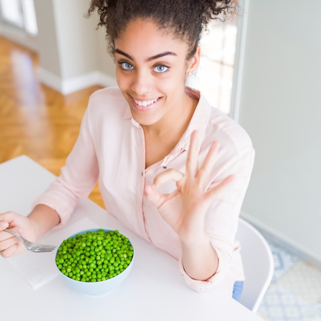 woman eating green