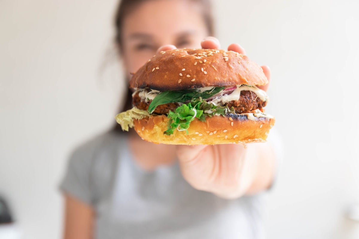 woman eating a veggie burger