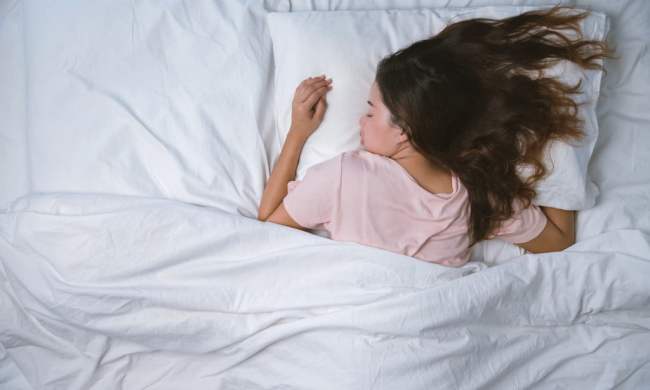 Woman with long hair sleeping