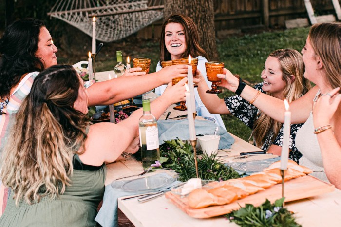 Friends toasting at an outdoor party