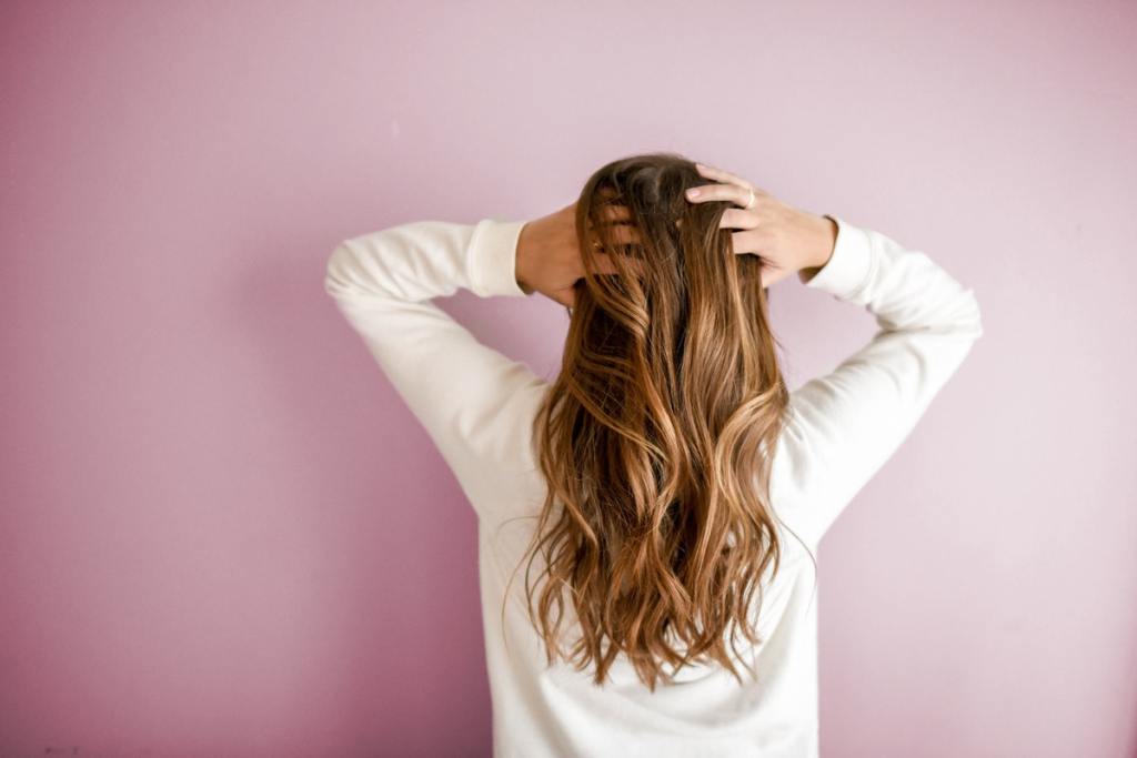 The back of the head of a woman with beautiful hair.