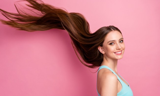 A woman with a healthy head of sleek hair.
