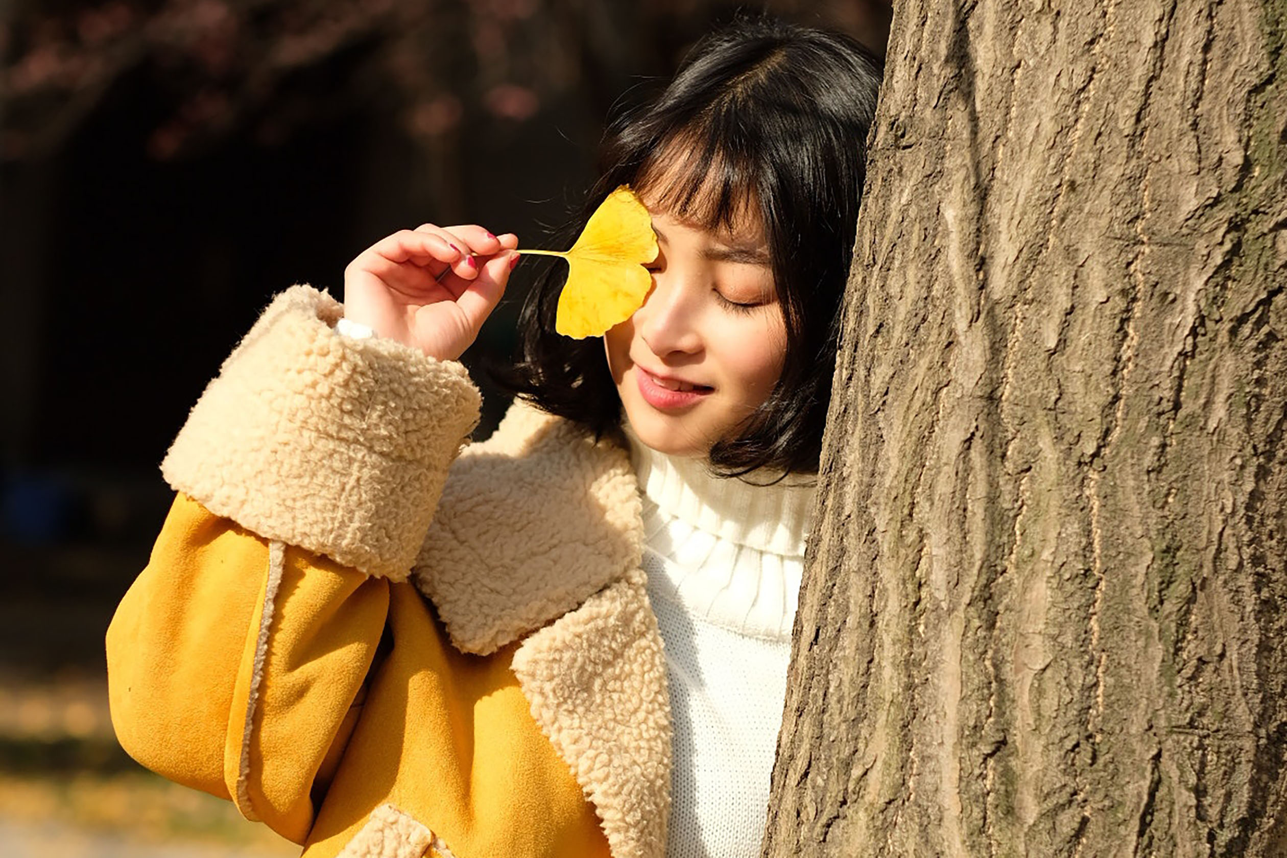 Woman in a fuzzy jacket and knit sweater
