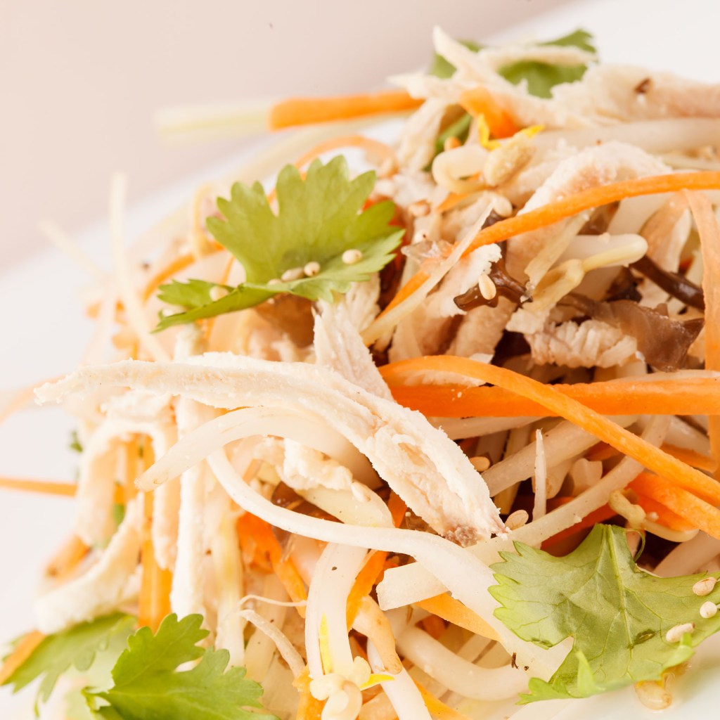 Chinese chicken salad on a white plate