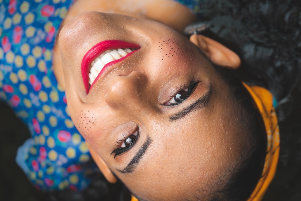 woman with red lipstick smiling