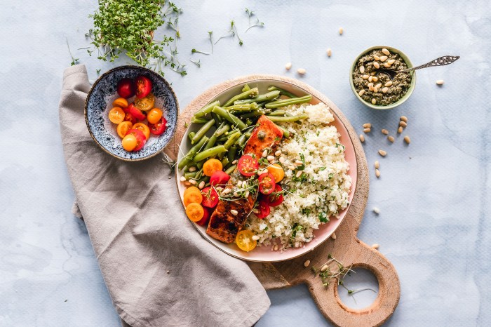 Quinoa bowl with salmon, tomatoes, and beans