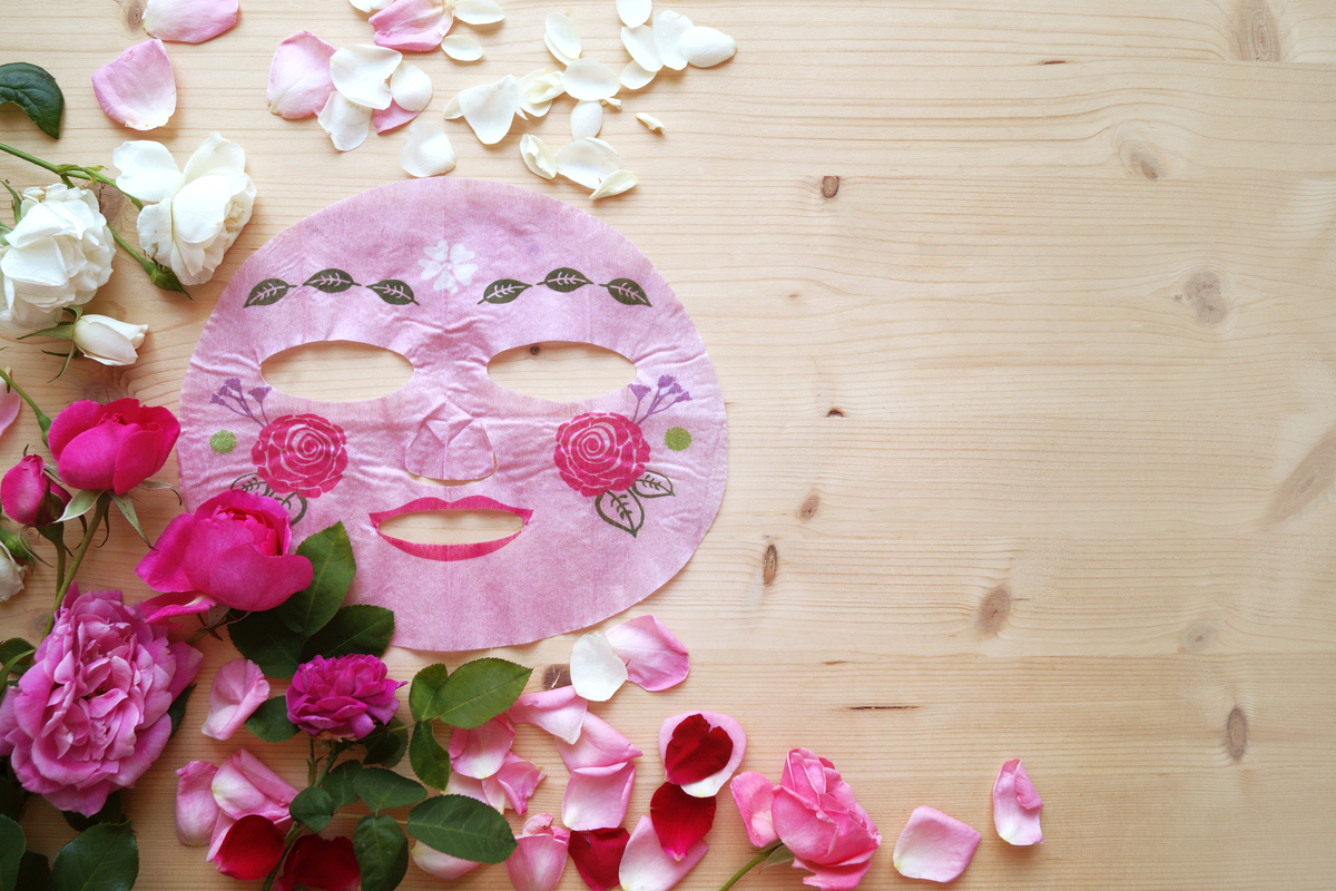 Face mask with flowers around it.