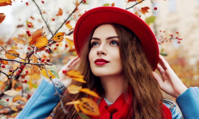 A woman in fall fashion and makeup.