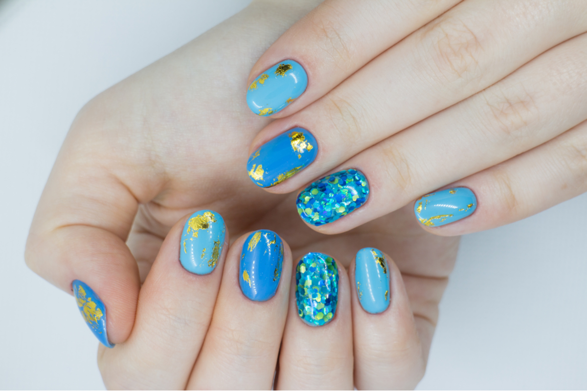 A set of nails with fun nail art.