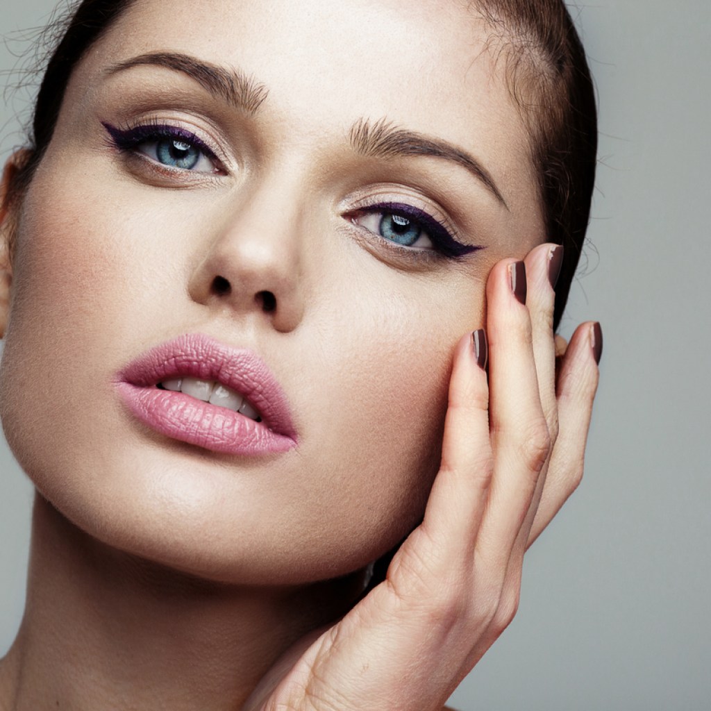 A woman with cat eye makeup.