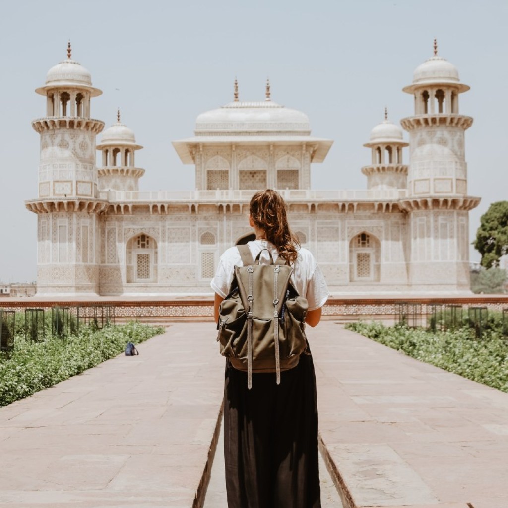 a solo traveler approaching Tomb of I’timād-ud-Daulah, Agra in India