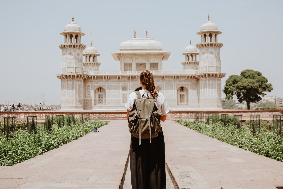 a solo traveler approaching Tomb of I’timād-ud-Daulah, Agra in India