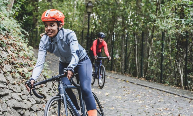 Two women biking in the woods