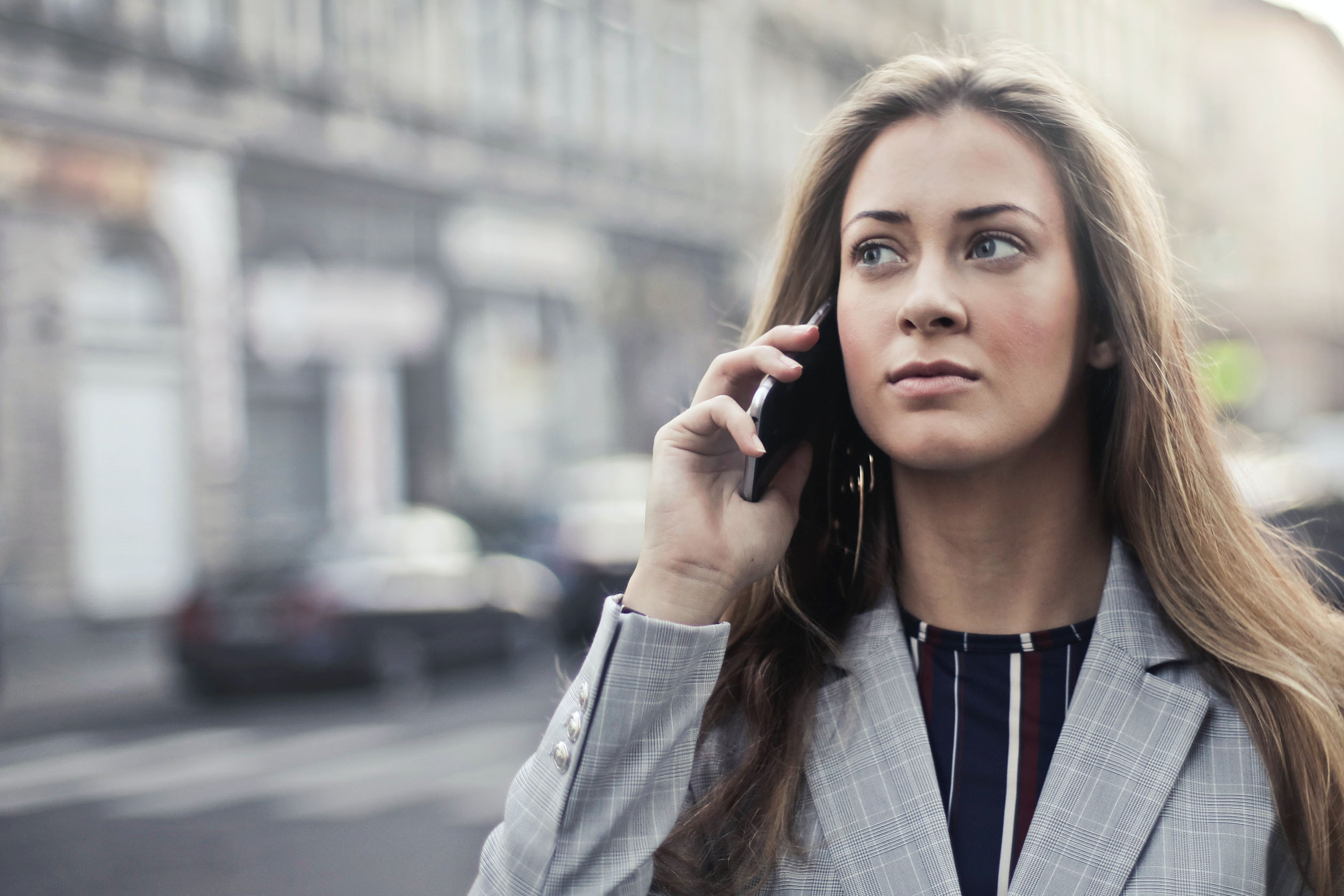 Woman talking on the phone outside
