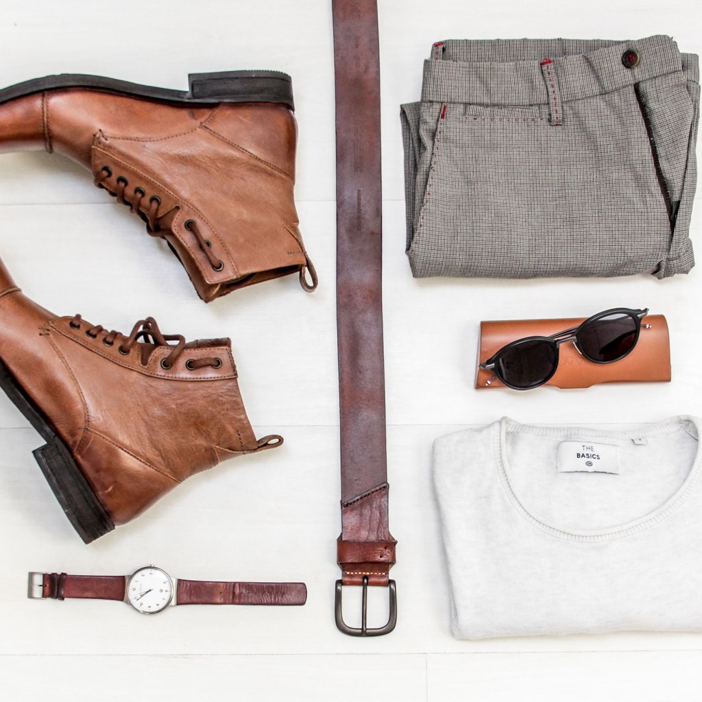 Flat lay of men's clothing and accessories