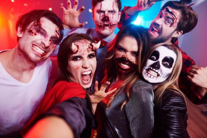 Group of friends wearing scary Halloween makeup